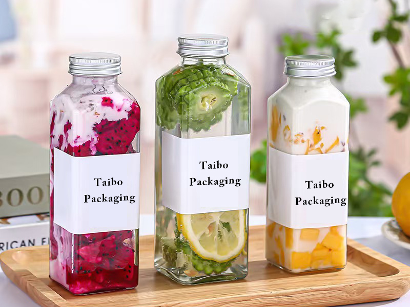 Wholesale square round glass juice bottle with lid
