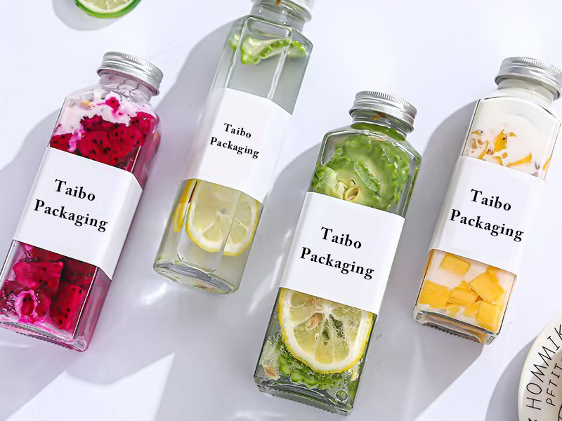 Wholesale square round glass juice bottle with lid
