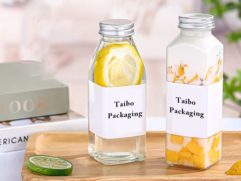 Wholesale square round glass juice bottle with lid
